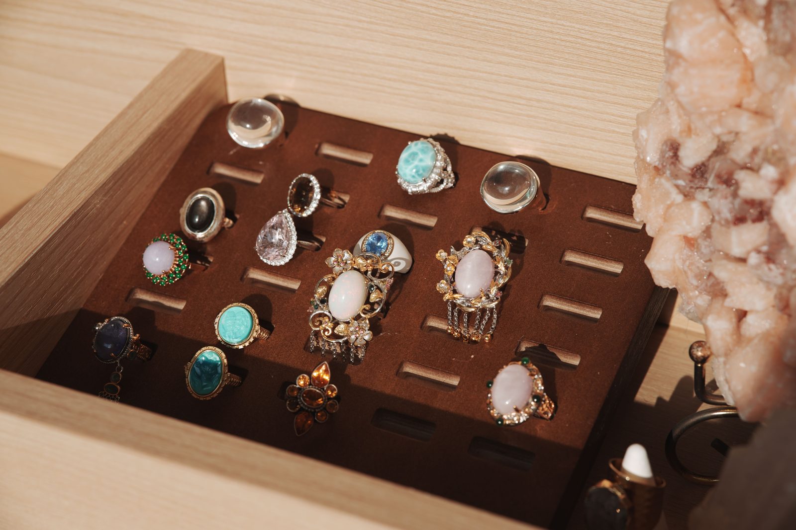 Tray of gemstone rings in silver settings